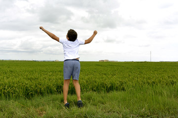 Fototapeta premium Boy and green field...