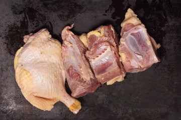 Raw duck meat on a dark background before cooking