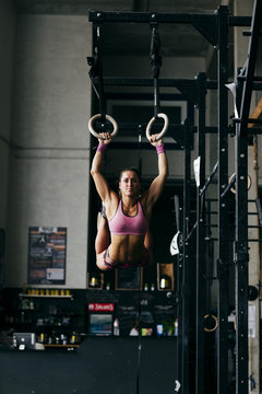 Woman training with rings