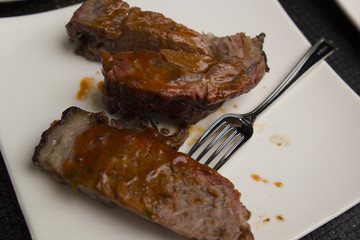 bbq grilled steak on white plate