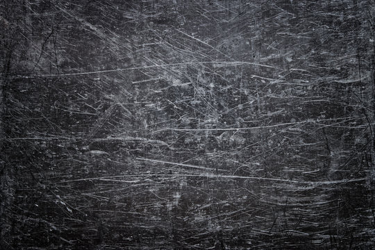 Damaged steel texture, dark metal background with scratches on the surface