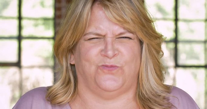 Very angry mad woman pointing her finger and shaking with fury