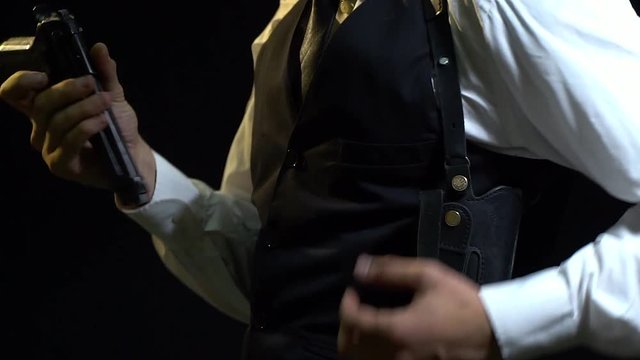Detective in a white shirt and vest effectively puts the gun in the holster, slow motion