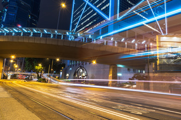 Fototapeta na wymiar night view of urban traffic with cityscape in Hong Kong,China.