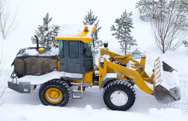 Winter landscape, snow cleaning machine