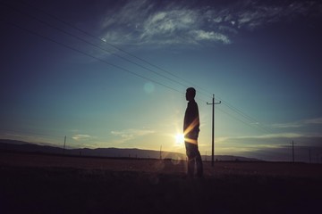 Man running during sunset. Silhouette.