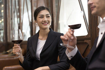 Woman testing Wine with attracitve smiling at restaurant. People Drinking Wine with Relax emotion.