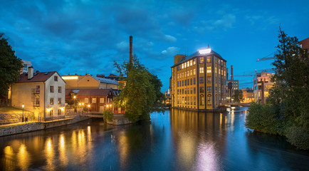 Fototapeta na wymiar Panorama of historical textile industrial area and Motala river in Norrkoping, Sweden