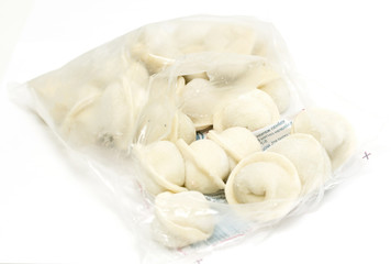 Fototapeta na wymiar bunch of fresh frozen dumplings ready for cooking, isolated on white background