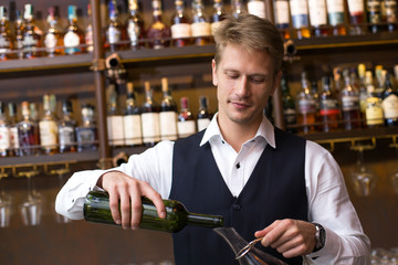 Sommelier preparing Wine to decanter at bar, Sommelier Working Concept.