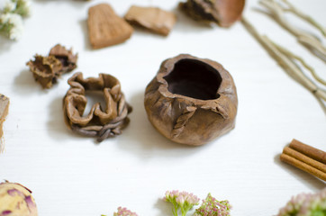 ceramic decorative salt salt wort. Clay dishes on the white wooden table