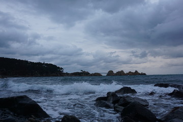 Beautiful seascape view of the ocean, rough, heavy sea with waves breaking the reef