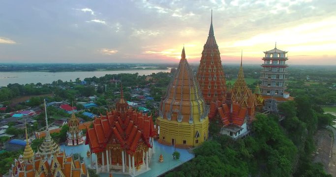 stunning scenery on Tiger cave temple in sunrise time

a golden Buddha,temple,pagodas and  Thai architecture building on hilltop. the most beautiful top ten of temples in Thailand 