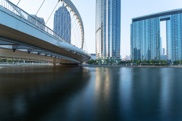Obraz premium Tianjin Hai river waterfront downtown skyline with Dagu bridge,China.