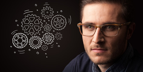 Portrait of a young businessman on dark background