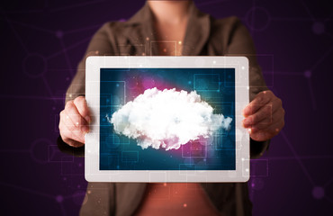 Woman holding tablet with cloud graphic