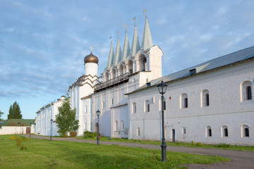Fototapeta na wymiar Bell tower of the Uspensky monastery in the cloudy September morning. Tikhvin, Russia
