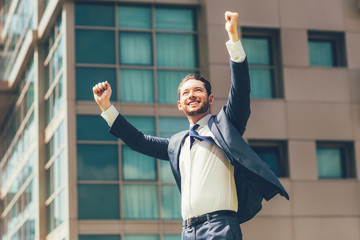 Cheerful Business Man Celebrating Success Outdoors