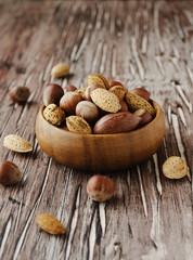 canvas bag with nuts on a wooden table