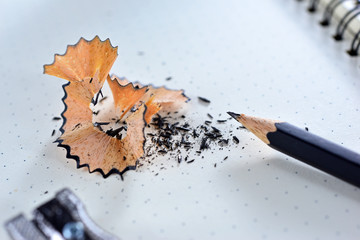 Closeup of blank notebook and pencil with copy space. Concept knowledge improvement. Office Supplies preparation. Sharpen the pencil. Development plan for yourself. Creative idea for design work