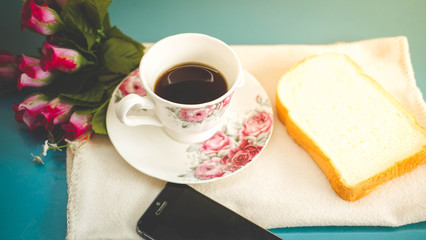 Morning is perfect for your favorite coffee,Coffee cup, soft coffee,Black coffee with bread Good for starting up in the morning.