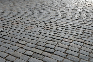 Old cobblestone pavement close-up.