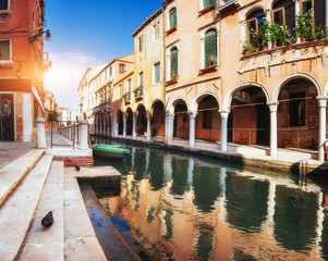 Gondolas on canal in Venice. Venice is a popular tourist destination