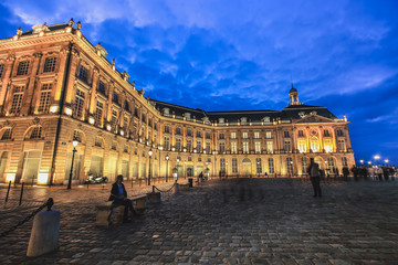Fototapeta premium Reflection of Place De La Bourse and tramway in Bordeaux, France. A Unesco World Heritage