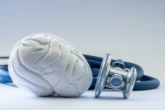 Brain near the stethoscope as symbol of health of organ, care, diagnostics, medical testing, treatment and prevention of diseases and pathology of brain as main neurological organ concept photo