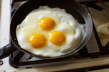 Eggs fry in a frying pan