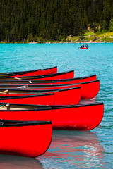 Row of red canoes at Lake Louise, Banff National Park, Canada