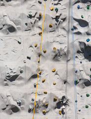 Yellow and Blue Ropes on a Climbing Wall on a Cruise Ship
