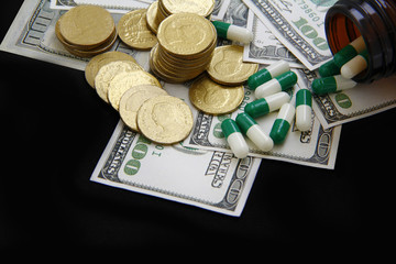 Expensive healthcare concept, Capsules and pills pouring from bottles, medicines on dollar on Black Background