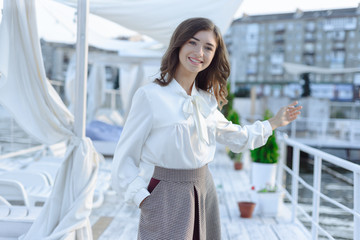 fashion portrait of happy beautiful girl in white shirt and casual dress