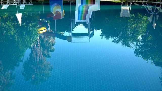 empty swimming pool with slides