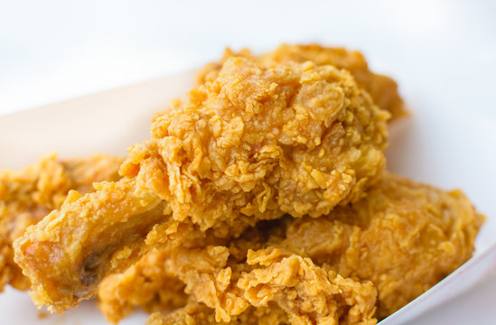 Crispy fresh fried chicken close up image.