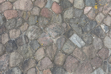 Steinmauer mit Feldsteinen Naturstein als Hintergrund in Kiel Schleswig-Holstein