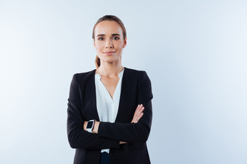 Pleasant confident woman standing cross armed
