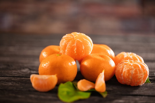 juicy mandarines fruits on the rustic table.