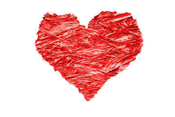 Heart shaped colorful bright red compressed wood chippings plywood with jagged rough edges and isolated on a white background