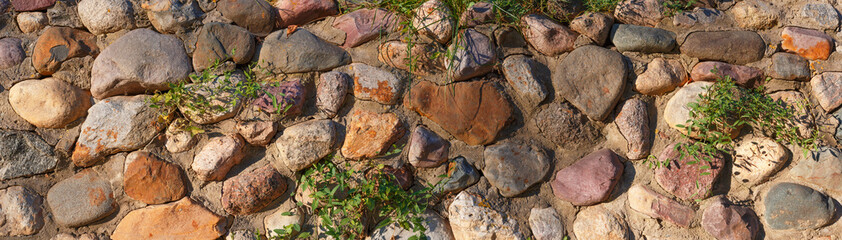 wall of natural stone and cement