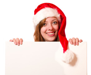 Attraktive Frau mit Nikolausm&uuml;tze und Schild 