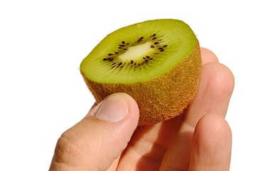 Kiwifruit also called chinese goosebery or latin Actinidia sliced in a half held in left hand on white background