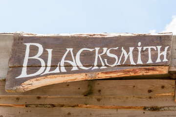 Blacksmith inscription  on the wooden board
