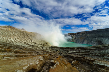 Beautiful Landscape mountain and green lake in the morning  at Kawah Ijen volcano , East Java, Indonesia