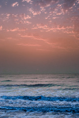 Golden sunrise sunset over the sea ocean waves