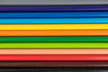 Rainbow of colors with school pencils school supplies and school accessories