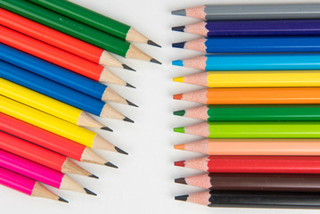 Rainbow of colors with school pencils school supplies and school accessories
