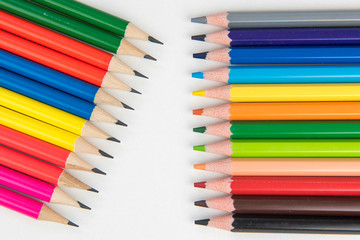 Rainbow of colors with school pencils school supplies and school accessories
