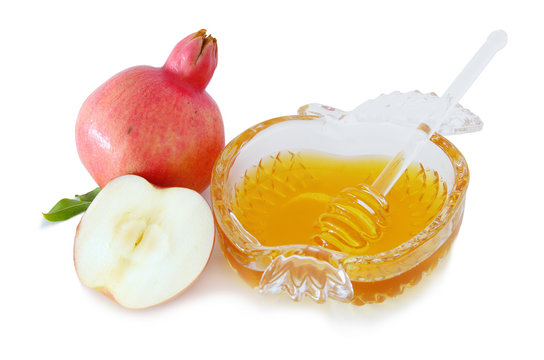 honey, pomegranate and apple isolated on a white. Rosh hashanah (jewish New Year holiday) concept